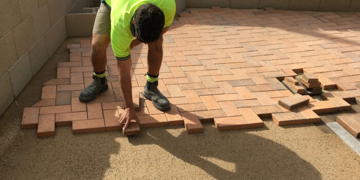 Laying-The-Pavers-700x350.jpg